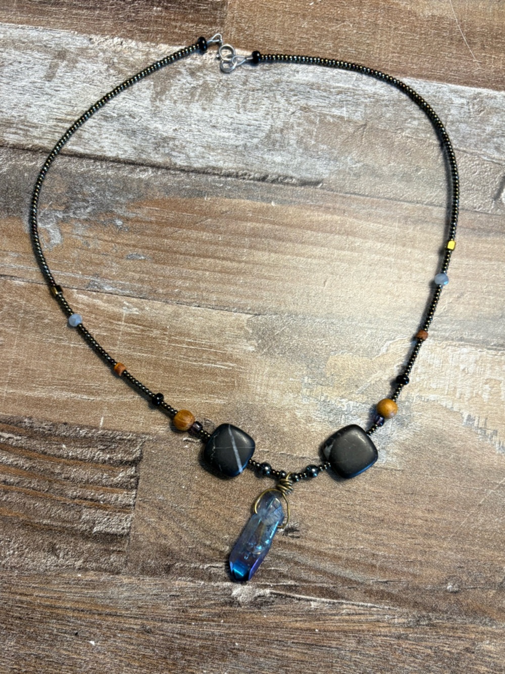 Black Bead Necklace with Blue Crystal Pendant